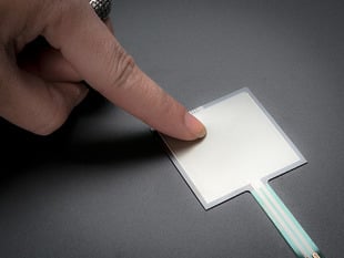 Demo Shot of a Finger pressing down on the Square Force-Sensitive Resistor (FSR).