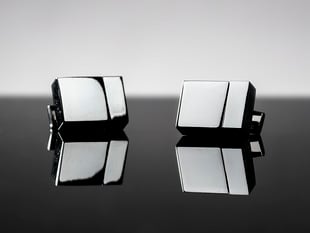 Two metal cufflinks shaped like USB drives