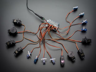 Top down view of a Adafruit 16-Channel 12-bit PWM/Servo Shield - I2C interface connected to 16 servos. 