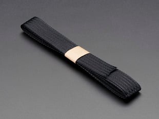 Angled shot of a black conductive thread ribbon cable.