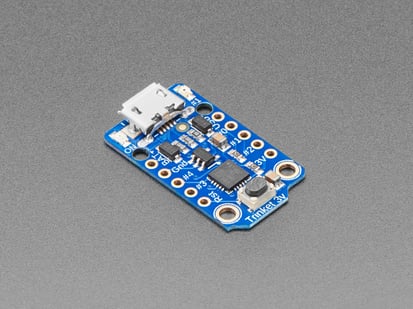 Adafruit Trinket - Mini Microcontroller - 3.3V Logic - MicroUSB - Angled shot of board