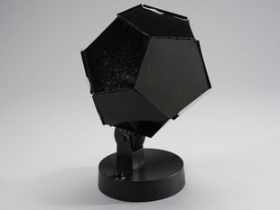 Black dodecahedron siting on a stand