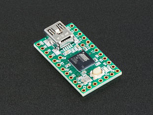 Angled shot of Teensy 2.0 dev board with ATmega32u4.