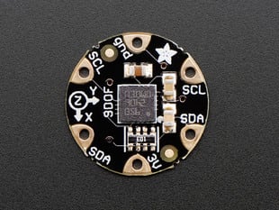 Top down view of a FLORA 9-DOF Accelerometer/Gyroscope/Magnetometer.
