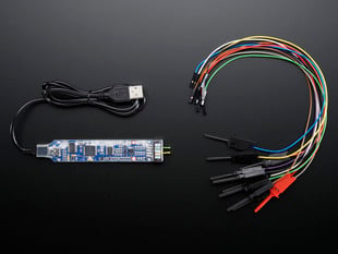 Top down view of a BitScope Micro USB next to ten mixed signal mini-grabber test probes.