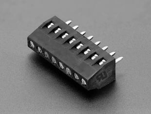 Angled shot of black 8-pin 2.54mm terminal block.