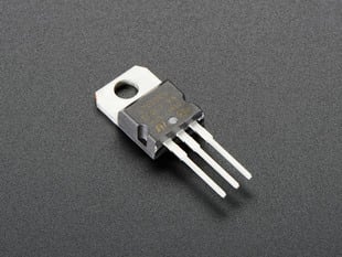 Chunky 3-pronged voltage regulator.