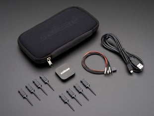 Angled shot of a Saleae Logic 4 - 4 Channels Logic / 1 Channel Analog and black zipper case. 