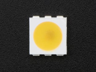 Top down view of a 5050 Warm White LED w/ Integrated Driver Chip. 