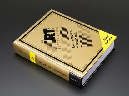 The Art of Electronics 3rd Edition by Horowitz & Hill HARDCOVER - Third Edition - Angled shot of hardcover "The Art of Electronics 3rd Edition" by Horowitz & Hill