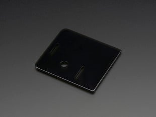 Angled shot of smoke-gray Raspberry Pi Model A+ Case Lid.