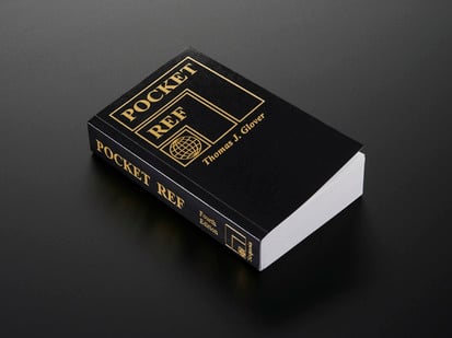 Pocket Ref - 4th Edition - by Thomas J. Glover - Angled shot of black tome Pocket Ref - 4th Edition - by Thomas J. Glover.