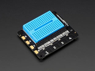 Angled shot of Pimoroni Explorer HAT Pro for Raspberry Pi with a blue mini breadboard.