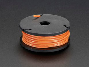 Orange stranded-core wire on a reel.
