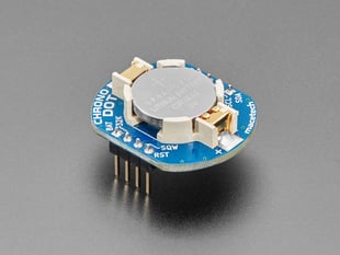 Angled shot of a ChronoDot - Ultra-precise Real Time Clock with a cell battery inserted. 