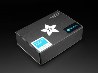 Microsoft IoT Pack for Raspberry Pi 3 - w/ Raspberry Pi 3 - Angled shot of a black box with the white Adafruit star-flower logo.