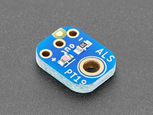 Angled shot of small, blue, square-shaped light sensor breakout.