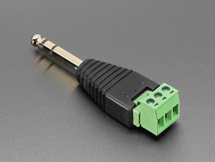 Reverse angled shot of 1/4" stereo plug adapter with three terminal blocks.
