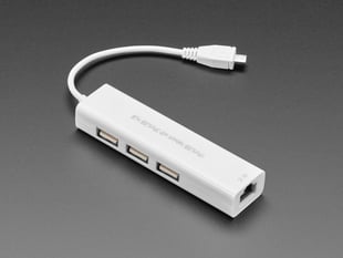 Angled shot of White hub with USB micro-B cable and Ethernet socket.