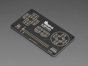 Angled shot of black, rectangular DIY game pad PCB.