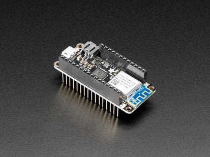 Assembled Adafruit Feather M0 WiFi with Stacking Headers - Angled shot of an Assembled Adafruit Feather M0 WiFi with Stacking Headers.