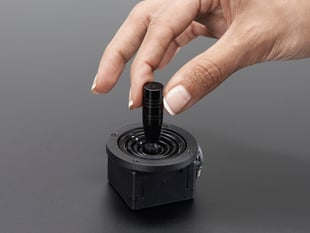 Hand gripping joystick knob of mini analog joystick