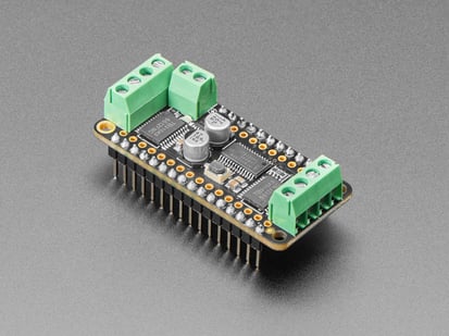 Assembled DC Motor + Stepper FeatherWing Add-on - Angled Shot of the Assembled DC Motor + Stepper FeatherWing Add-on