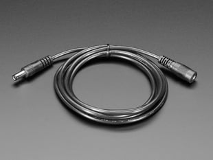 Barrel jack extension cable coiled in a bundle