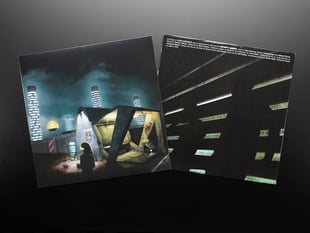 Top view of album cover of Infinity Shred - "Long Distance Adafruit Edition" with insert sleeve half-pulled out.
