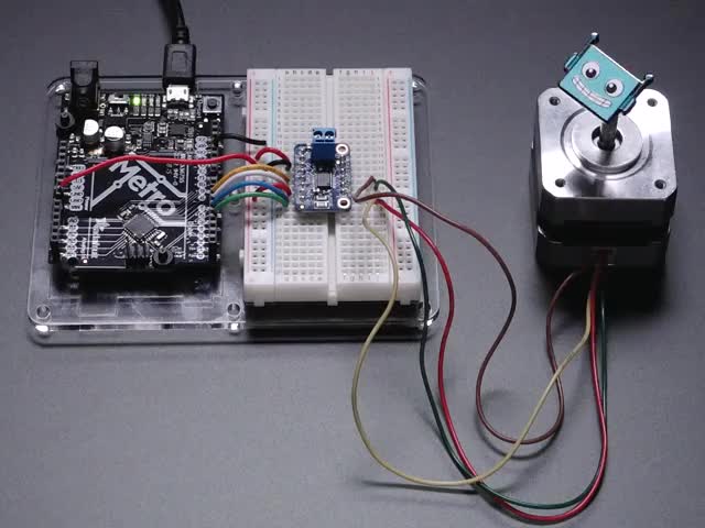 Adafruit DRV8833 DC/Stepper Motor Driver Breakout Board - Video of a Adafruit DRV8833 DC/Stepper Motor Driver Breakout Board connected to a half sized white board powering a stepper motor with a adabot head spinning on it. 