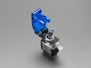 Angled Shot of the Illuminated Toggle Switch with Cover (Opened) - Blue