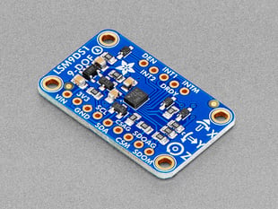 Angled shot of blue, rectangle-shaped 9-DOF breakout board.