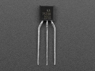 Overhead shot of black, 3-prong controller transistor.