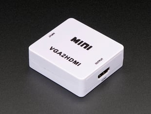 Angled shot of small, square-shaped, light pink video converter.