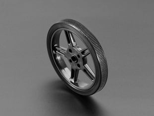 Angled shot of a black, skinny plastic wheel.