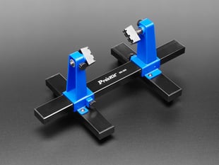 Black and blue PCB clamp holder with two arms. 