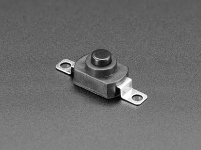 Mini On/Off Push-Button Switch - Angled shot of black mini on/off pushbutton switch with two mounting holes.