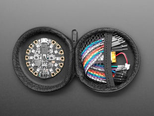 opened Round Black Zipper Case with circuit playground and components 