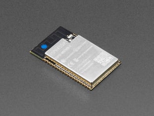Angled shot of rectangular Wi-Fi module with castellated pads.