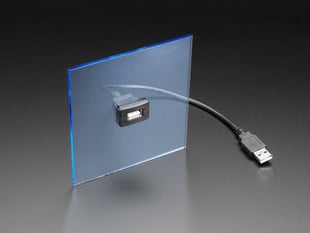 Demo Shot of the Snap-In Panel Mount Cable - USB A Extension Cable, secured in a flat blue square acrylic panel. 