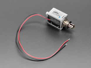 Push-pull solenoid with red and black wires.