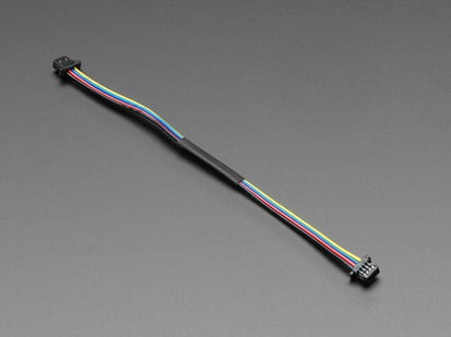 STEMMA QT / Qwiic JST SH 4-pin Cable - 100mm Long - Angled shot of STEMMA QT / Qwiic JST SH 4-pin Cable.