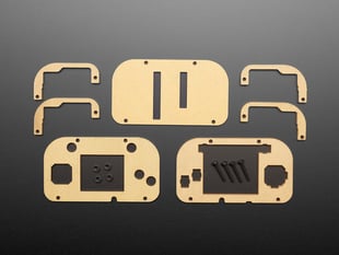 Enclosure pieces and black, plastic hardware for a DIY handheld game console.