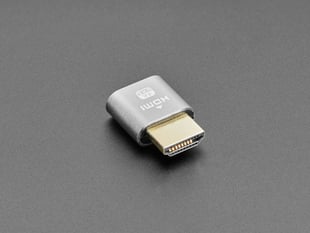 Angled shot of a small, gray, HDMI dummy plug.