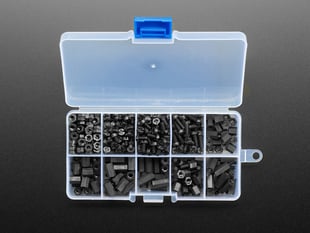 Opened box showing many nylon screws