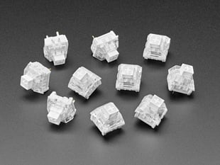 Angled shot of ten white Kailh key switches.
