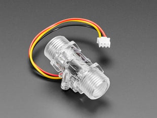 Angled shot of clear turbine flow sensor.