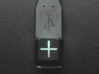 Close-up video of Zener ESP Plus keycap glowing rainbow colors.
