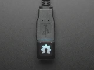 Top view video of OSHWA keycap glowing rainbow colors.
