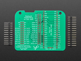 Top view of Raspberry Pi Pico Adapter for Keyboard FeatherWing betwee two pieces of 0.1" headerl